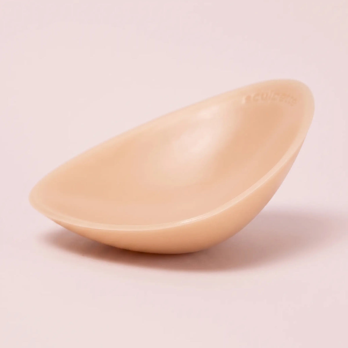 Close-up of The Sculpt insert showing the tapered edge and the adhesive face