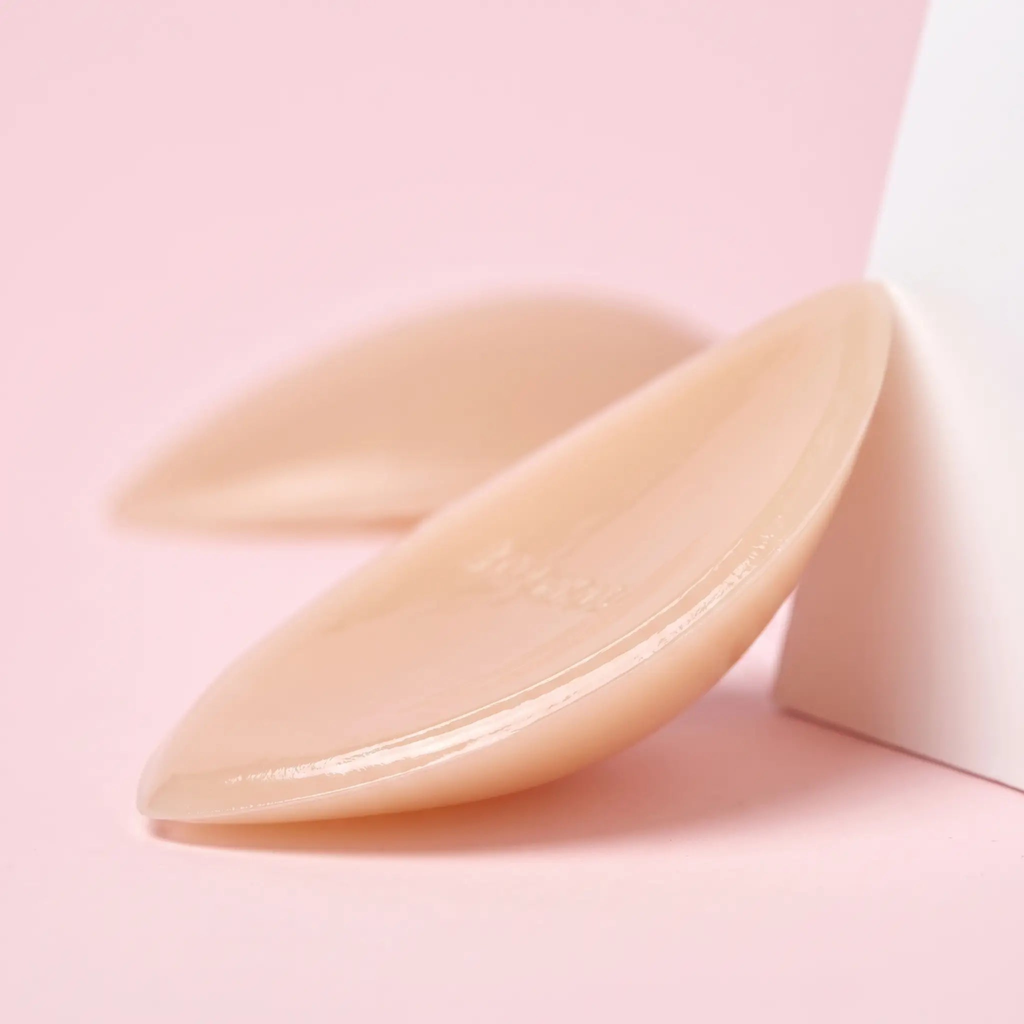 Close-up of The Sculpt Lite insert showing its thin edge and glossy adhesive face