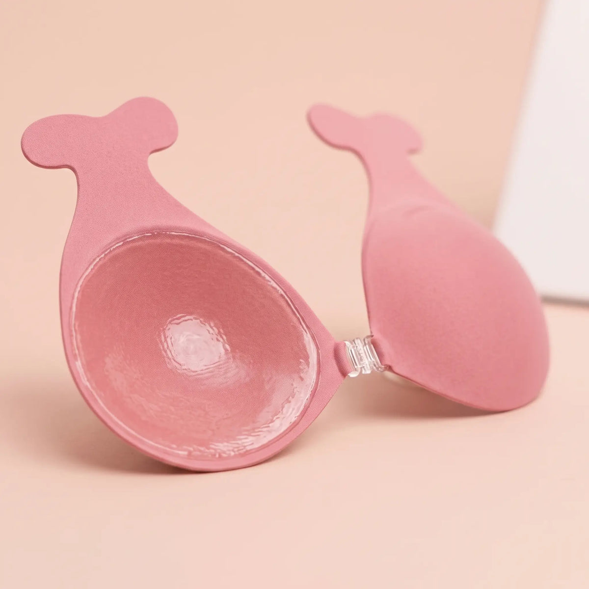 Inside of The Statement Bra cup showing the adhesive face and the clear front clasp