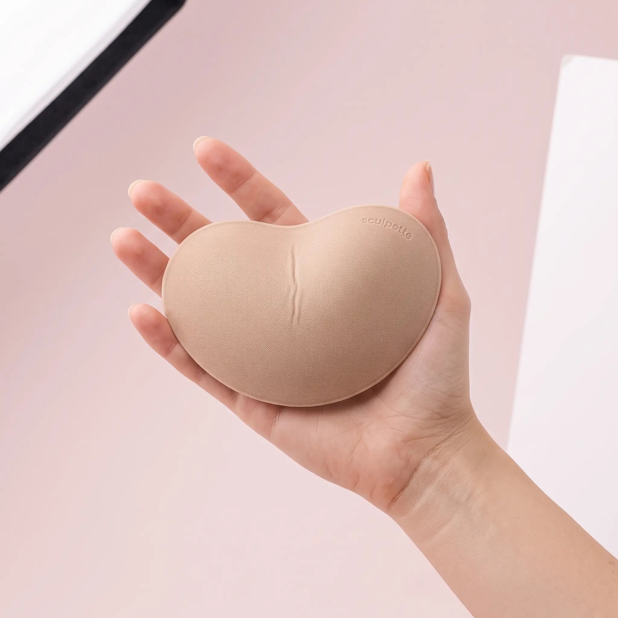 The Sweetheart insert on an open hand to show its true size
