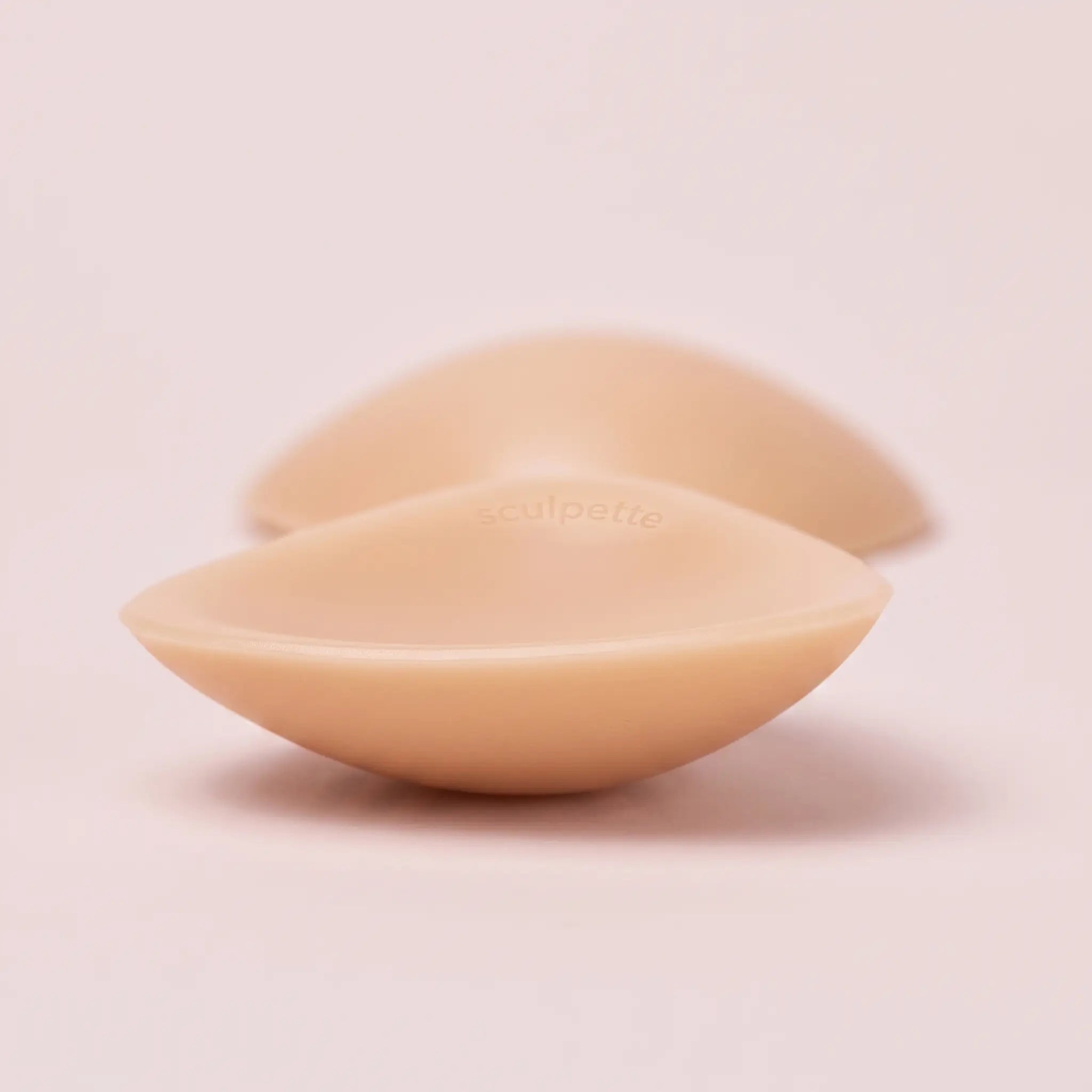 Close-up of The Sculpt Petite insert showing the tapered edge and the adhesive face