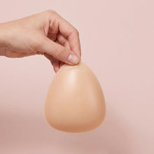 A single Sculpt insert held in the hand to show its size