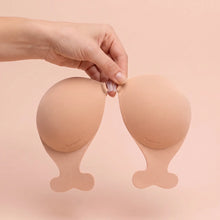 The Statement Bra held up by its clasp to show the cup size