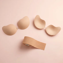 The Strapless Set flat lay - the Statement Bra, the Invisible Bra and a roll of nude body tape