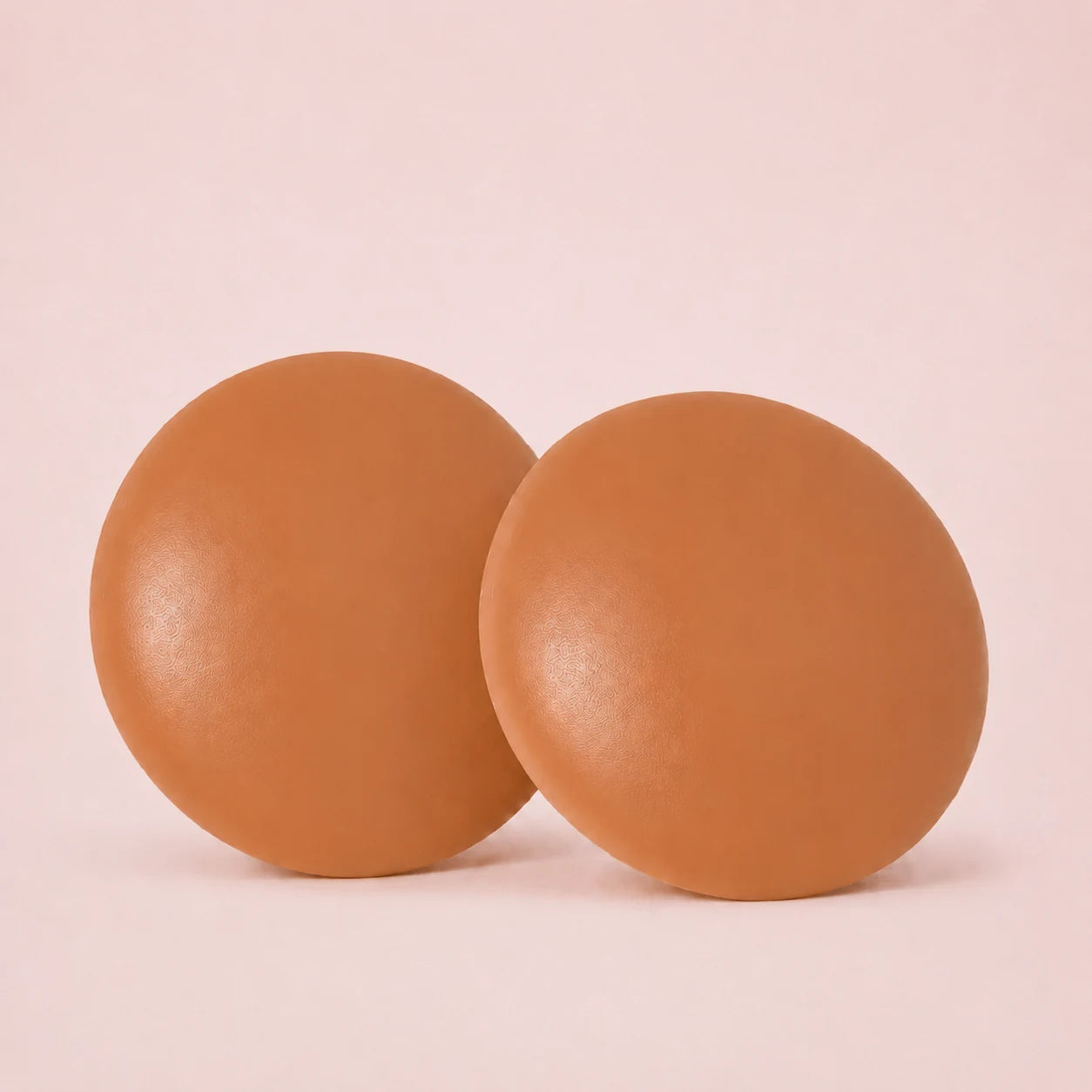 Sculpette The Sculpt Round adhesive silicone covers in Caramel, a medium-deep skin tone